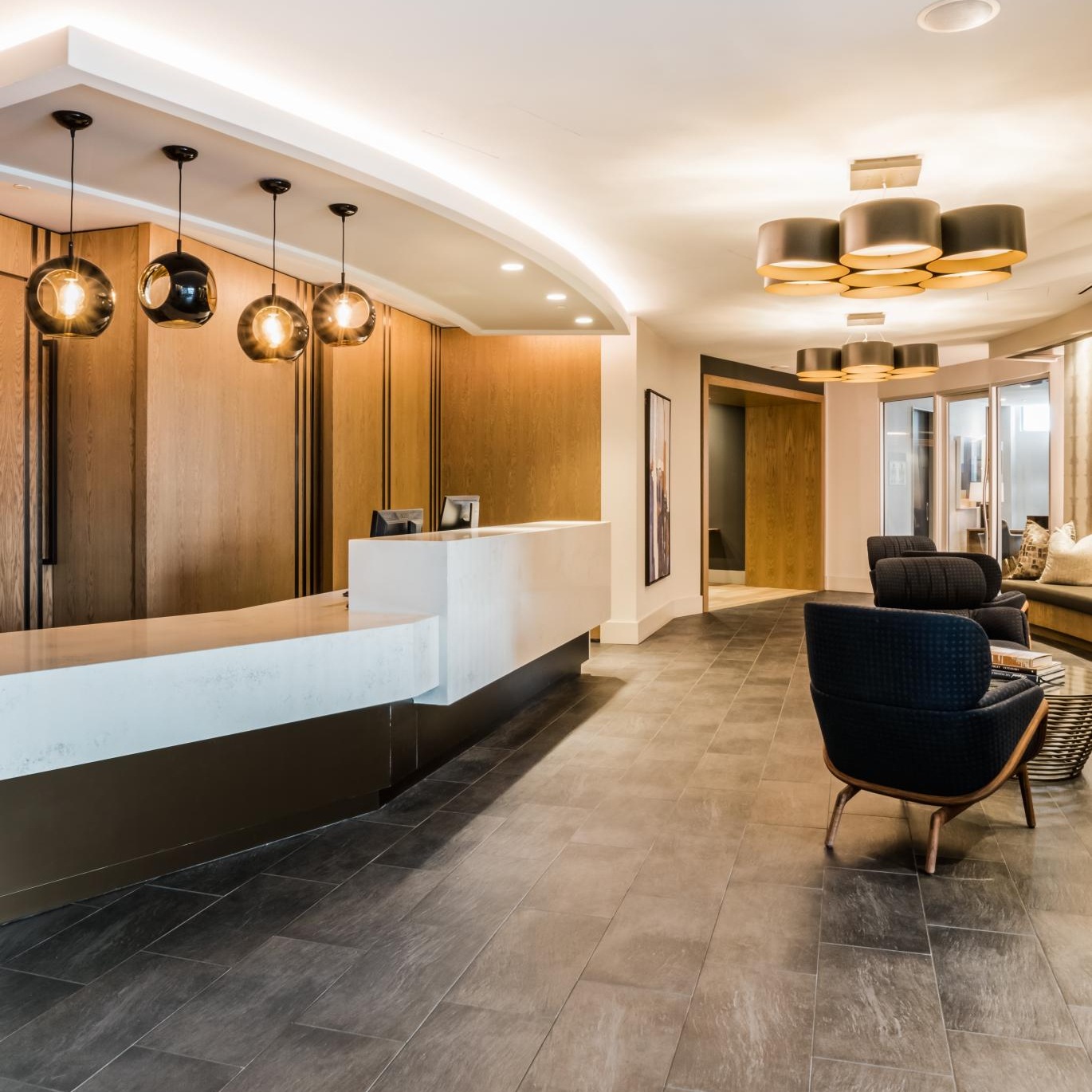 a leasing office with a front desk and chairs